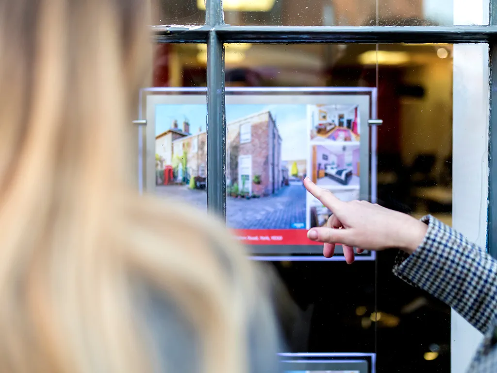 Property particulars displayed in an agent's window