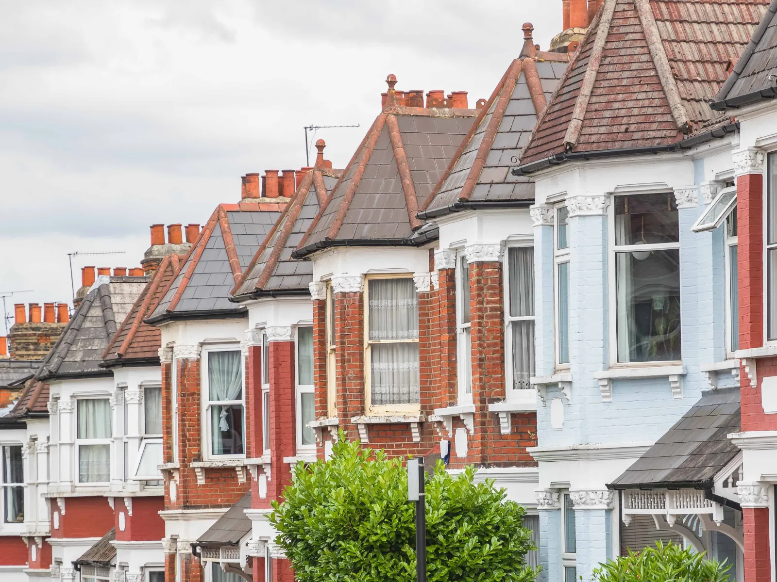 Row of red-brick Victorian terraced houses